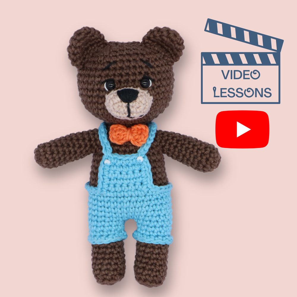 Theo the Teddy Bear crochet video course - amigurumi bear in blue overalls with orange bow tie