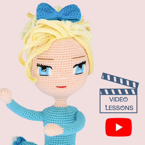 Eyes Embroidery crochet video course - close-up of amigurumi doll face with blue embroidered eyes