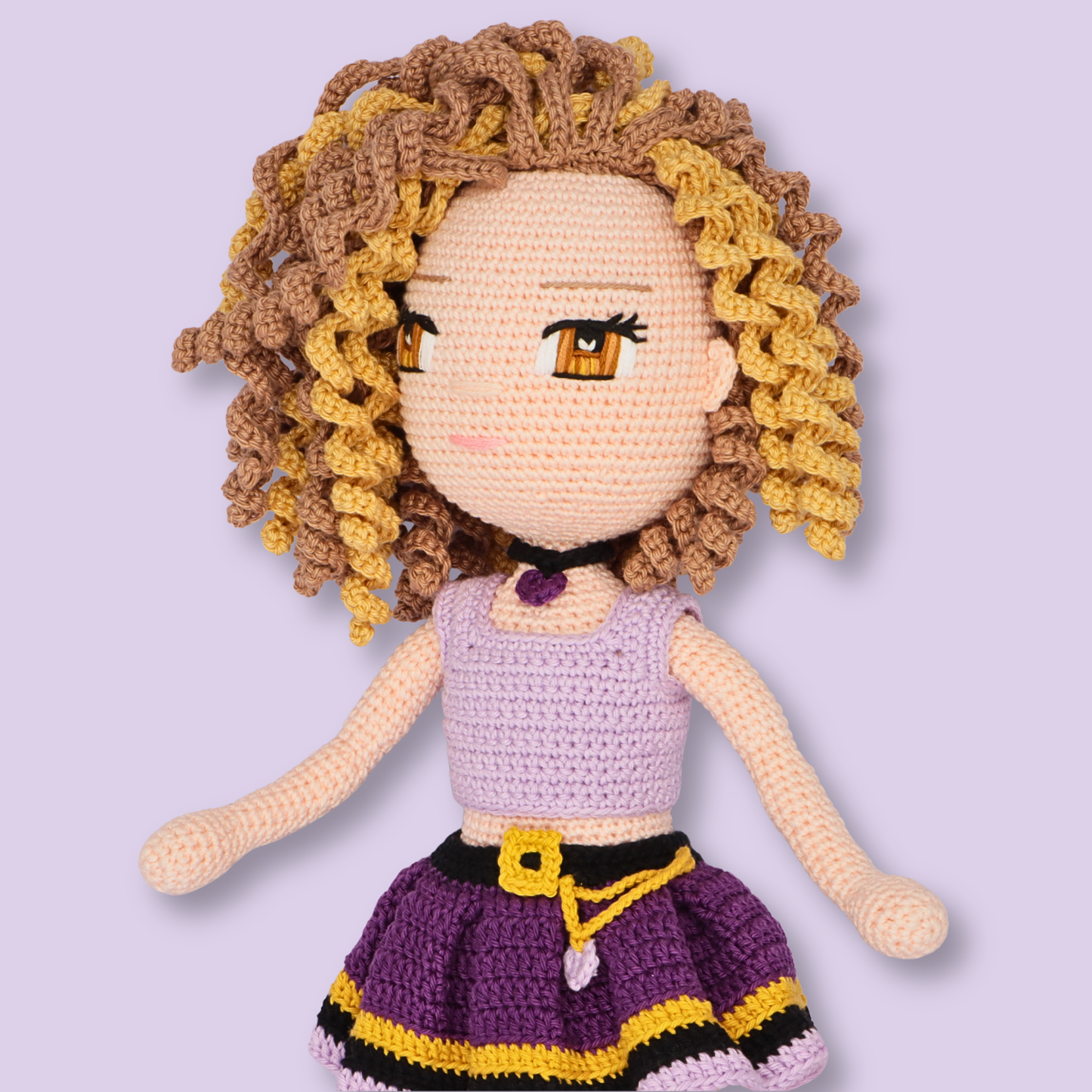 Close-up of Alice amigurumi doll in lilac top and purple belted skirt - crochet doll pattern