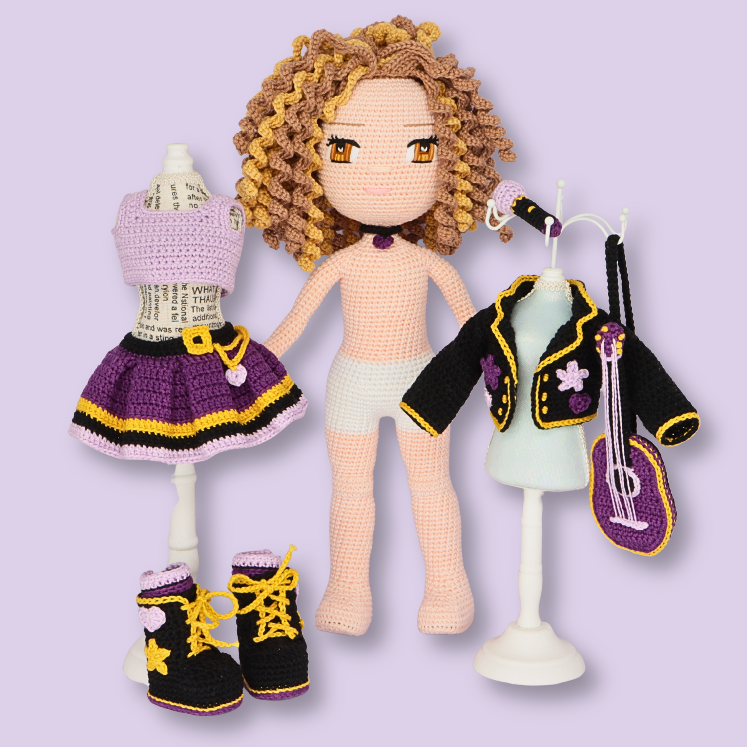 Alice amigurumi doll with her complete removable outfit set: top, skirt, jacket, boots, and guitar