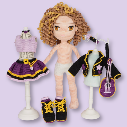 Alice crochet doll standing between her outfit pieces on mini mannequins - amigurumi doll pattern