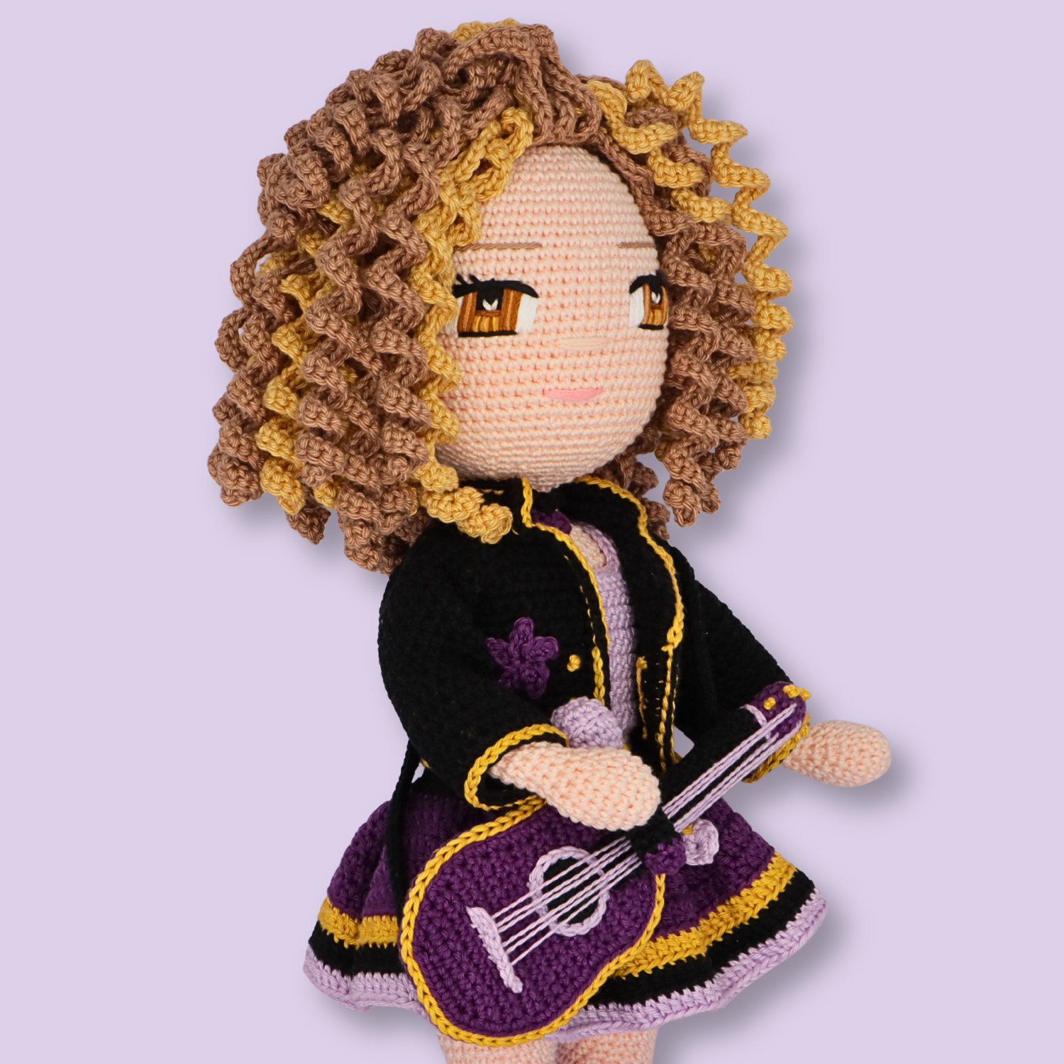 Three-quarter close-up of Alice amigurumi doll with guitar - crochet doll pattern by Crochetree