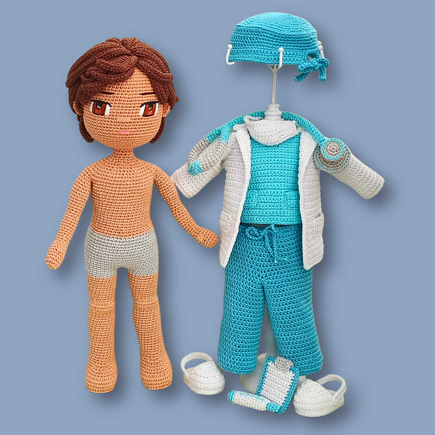 Dr. Thomas base doll next to the full removable doctor outfit: scrub cap, lab coat, scrubs, and two pairs of shoes